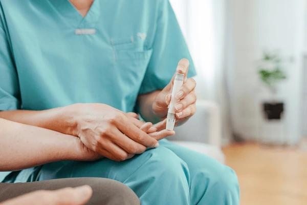 Patient receiving diabetes education and monitoring