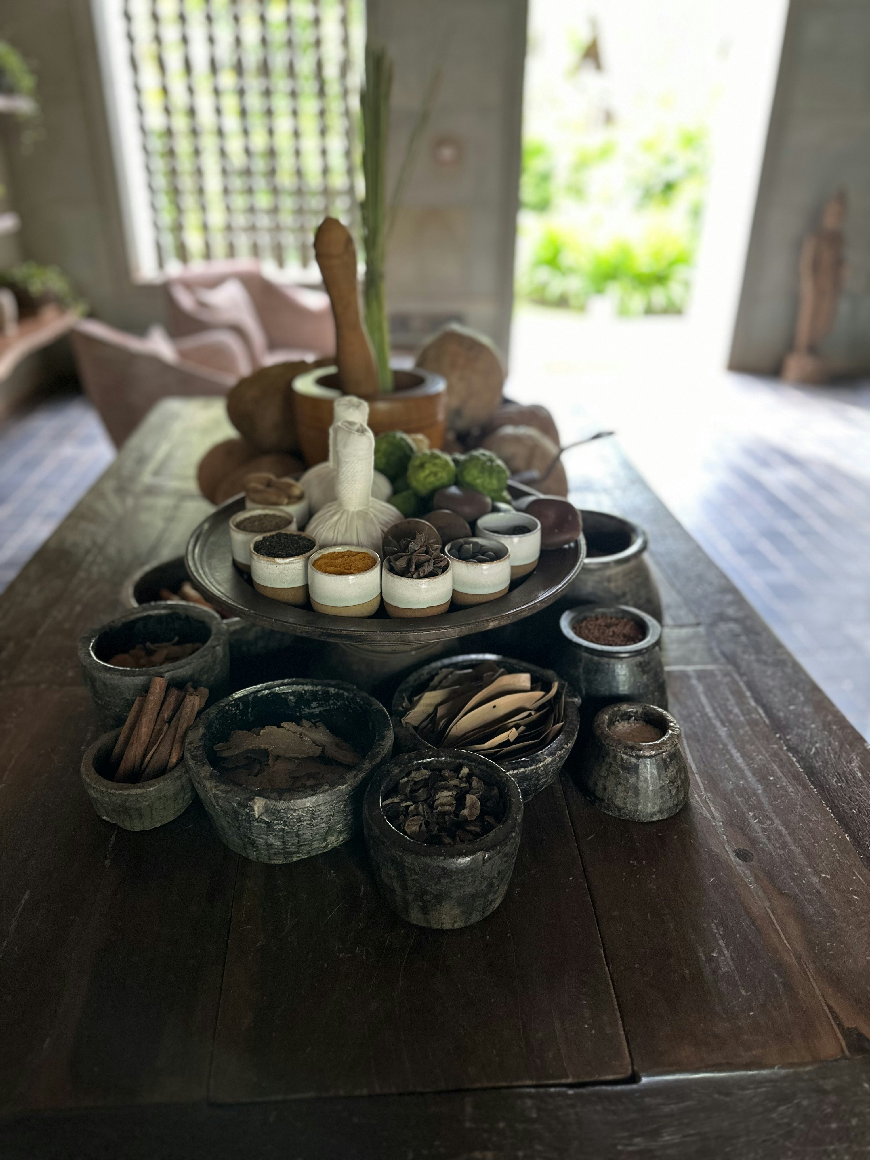 Ayurvedic herbal medicines and natural treatment products arranged on wooden table for piles care